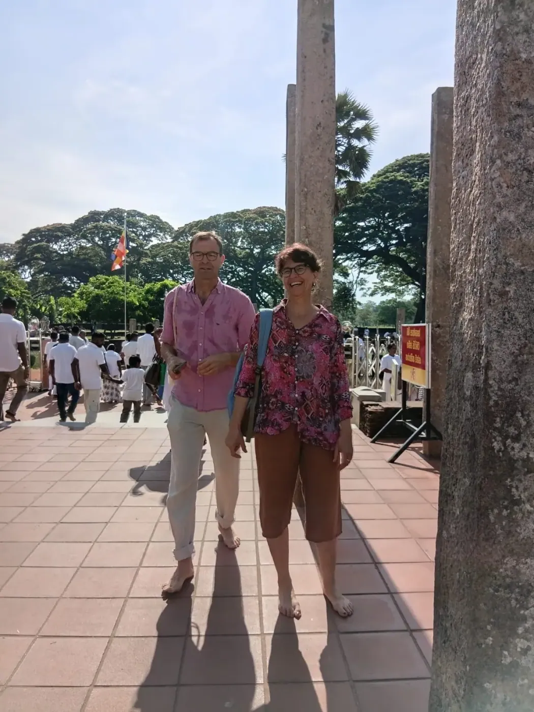 A couple at the entrance of a Kandyan temple