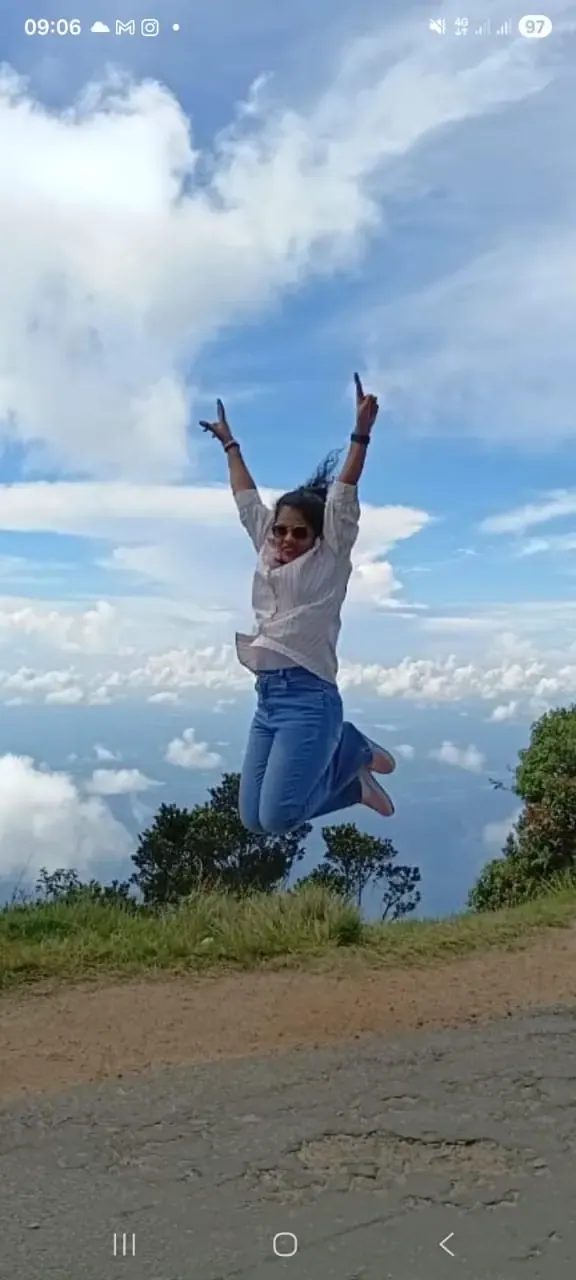 A guest jumping above the clouds in the highlands
