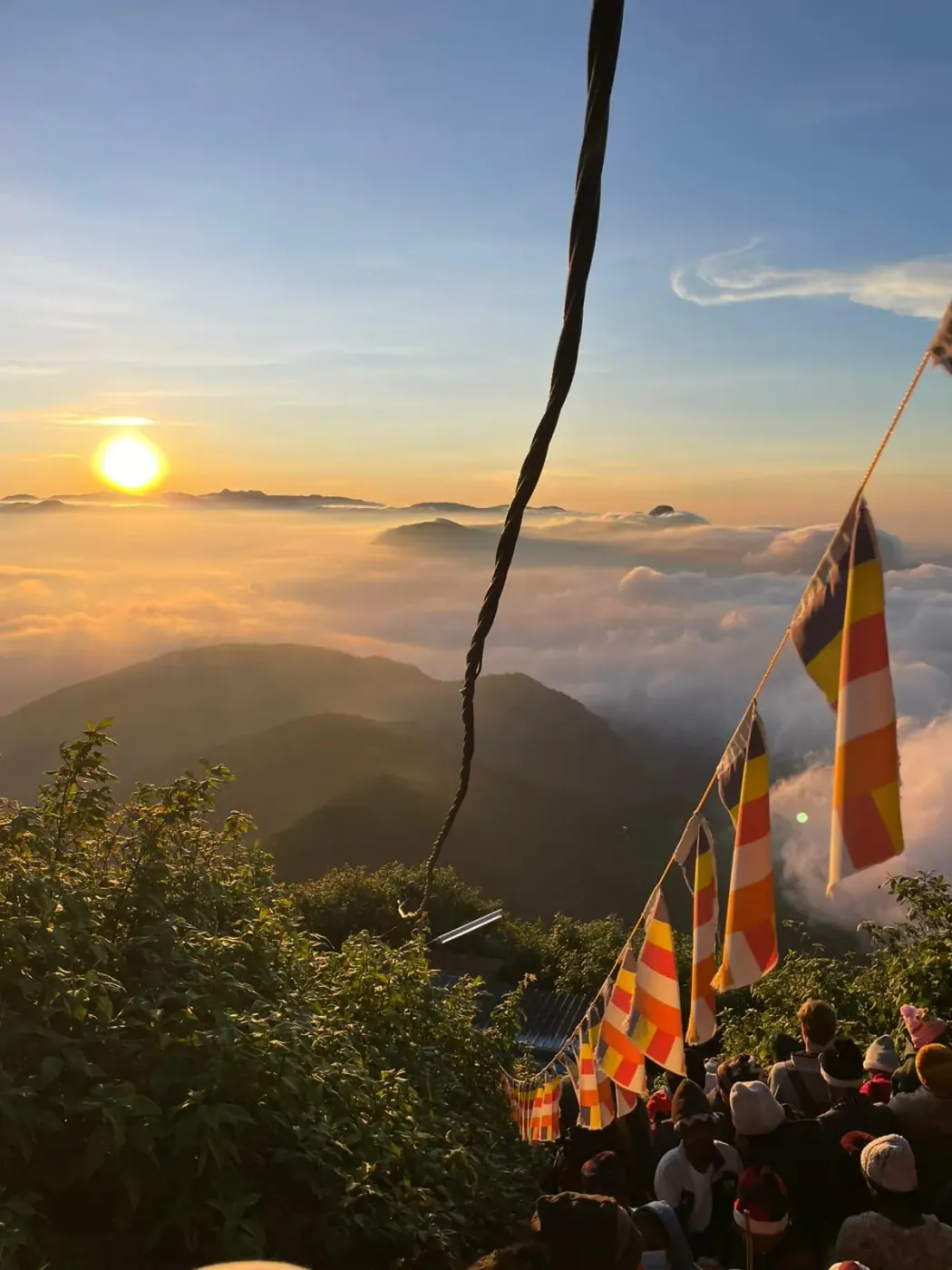 Sunrise over the hill country with Buddhist prayer flags