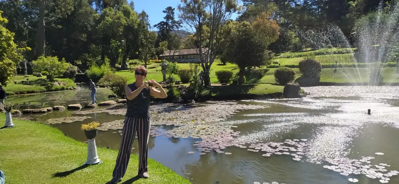 A guest beside the water lily pond in the Royal Botanical Gardens