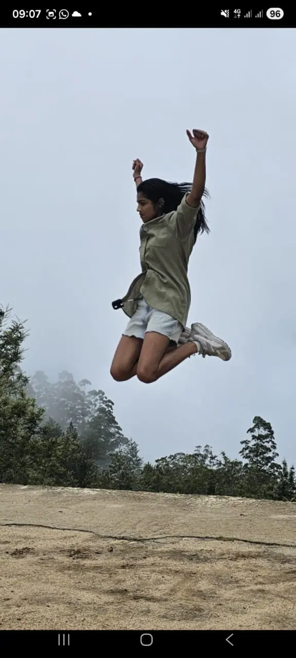 A traveller mid-jump against the Sri Lankan sky