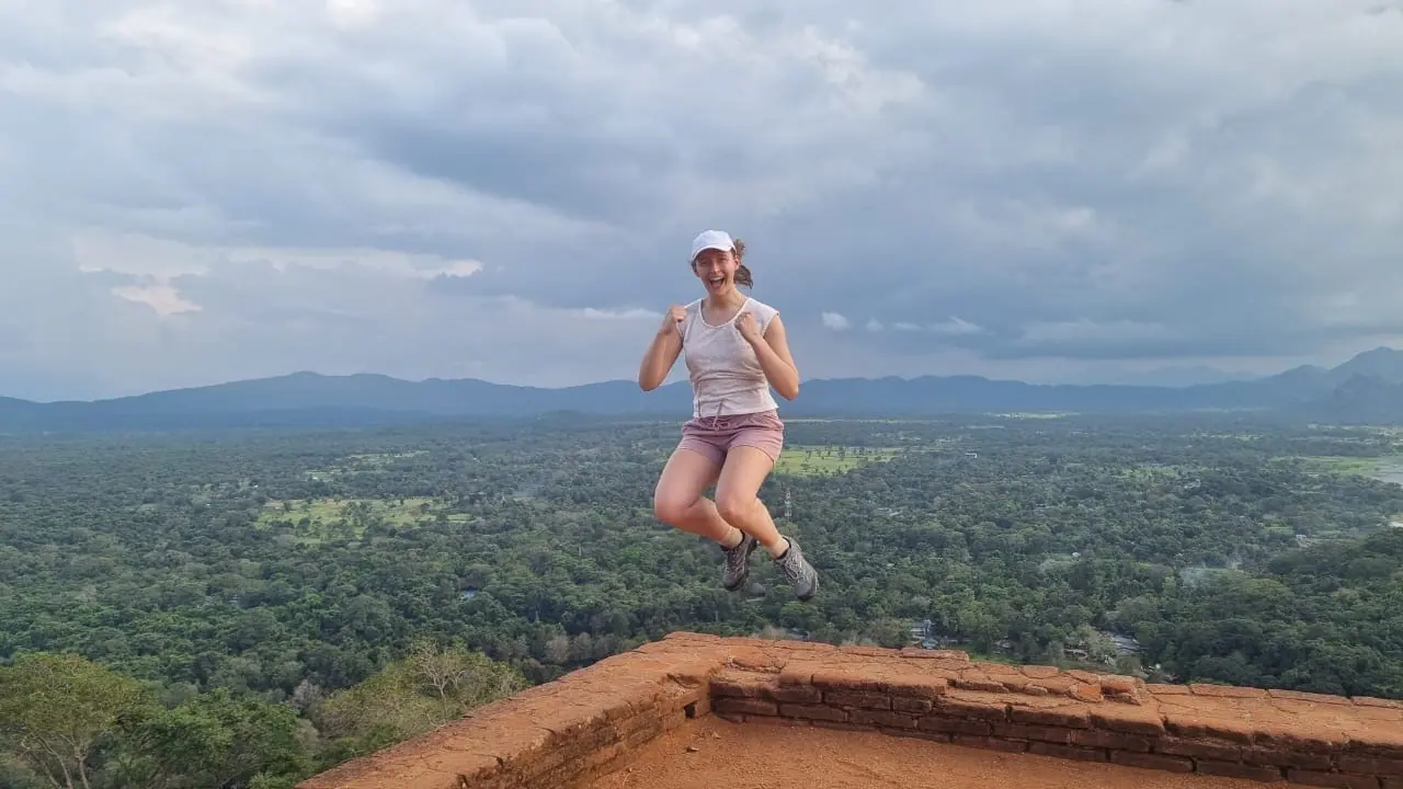 A guest leaping for joy on the summit of Sigiriya rock fortress