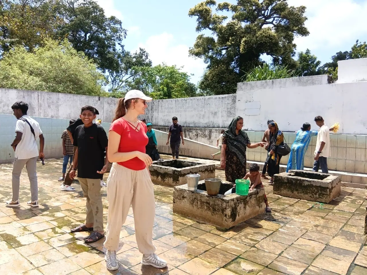 A guest walking through the stone ruins of an ancient city