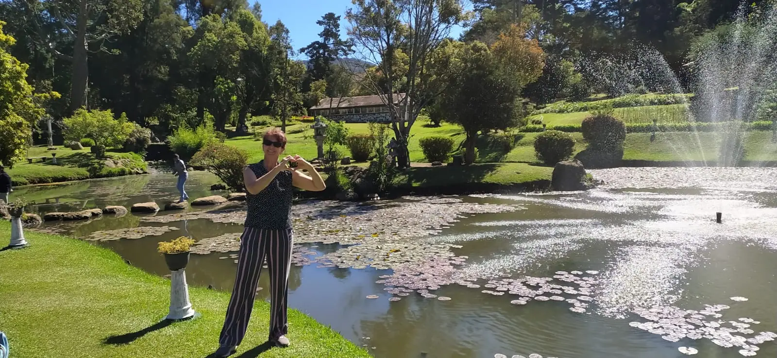 A guest beside the water lily pond in the Royal Botanical Gardens
