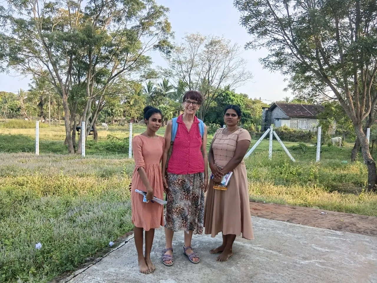 Guests walking with local women in a northern village